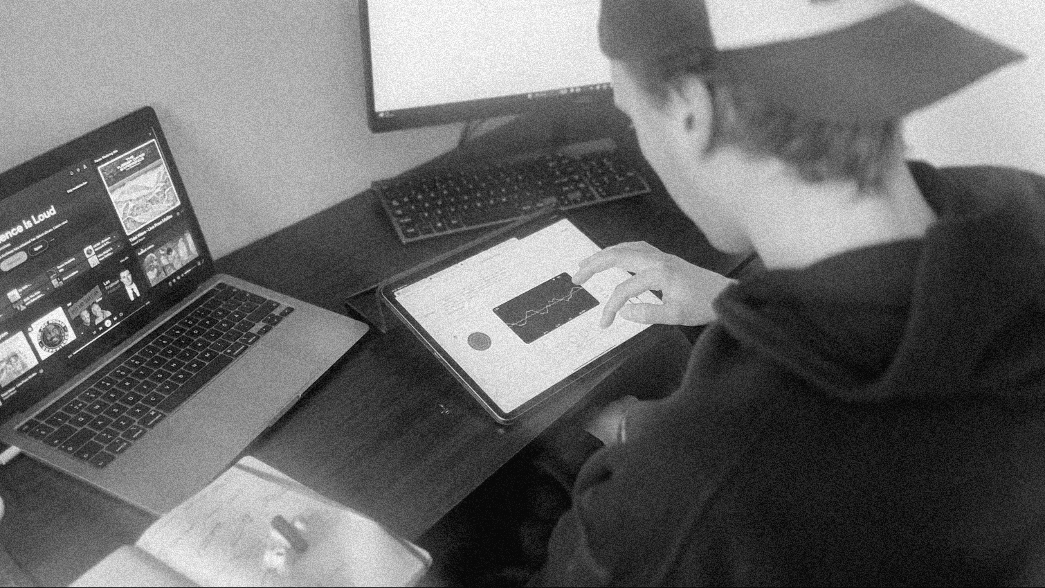 A person using a tablet to test a waveform-based visual interface.